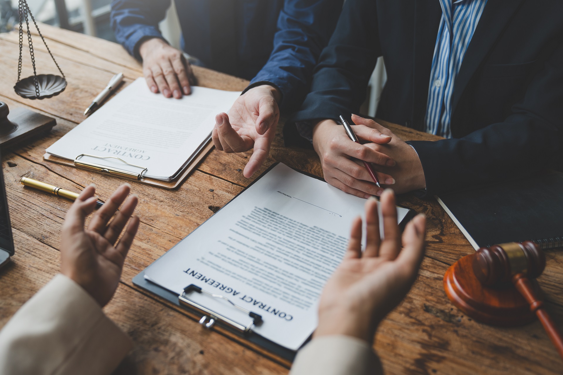 Lawyers, legal advisors, businessmen, investors brainstorm to clarify details of agreements, business contracts, joint financial investments in office real estate projects