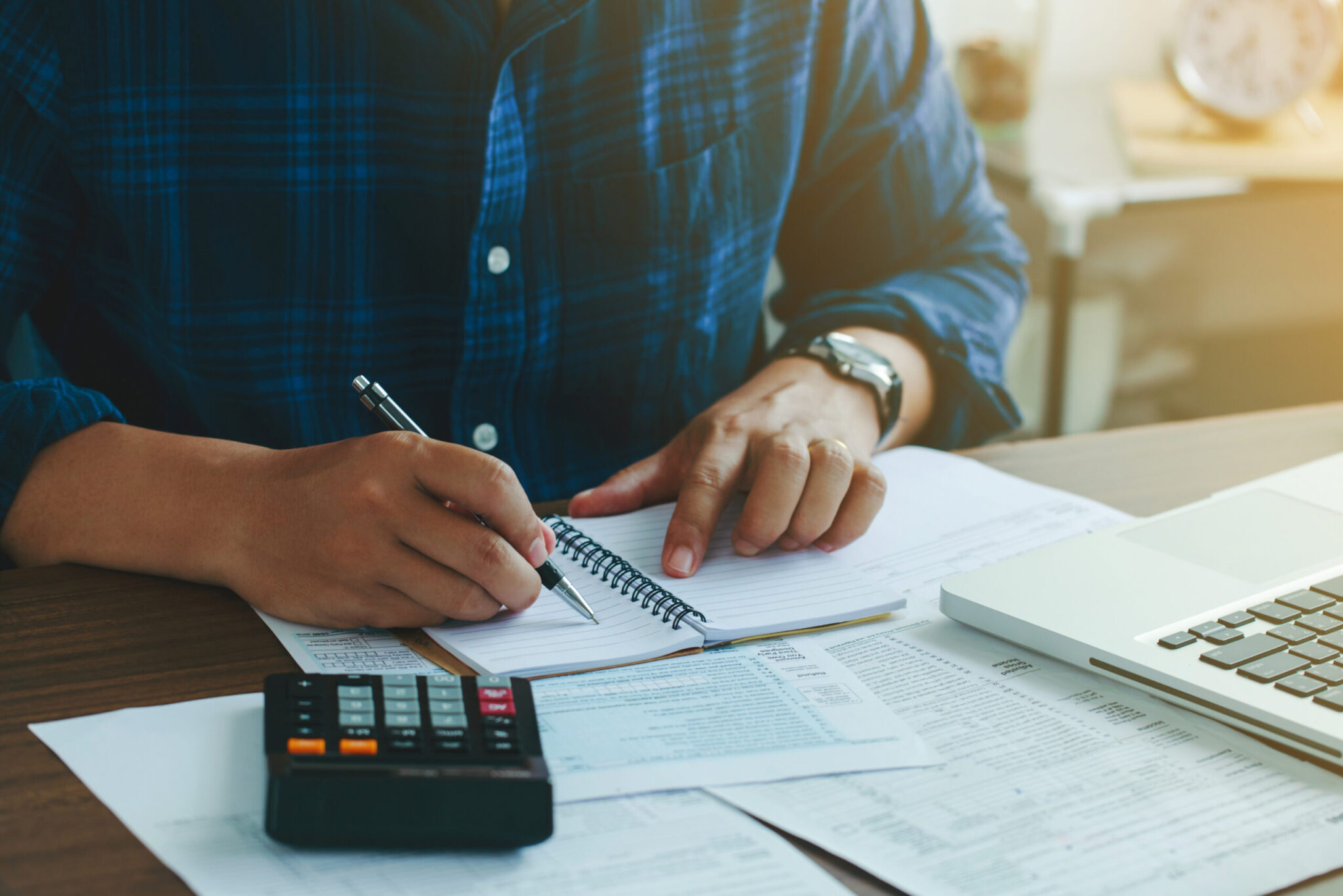 Man doing finances and calculate about cost to real estate inves